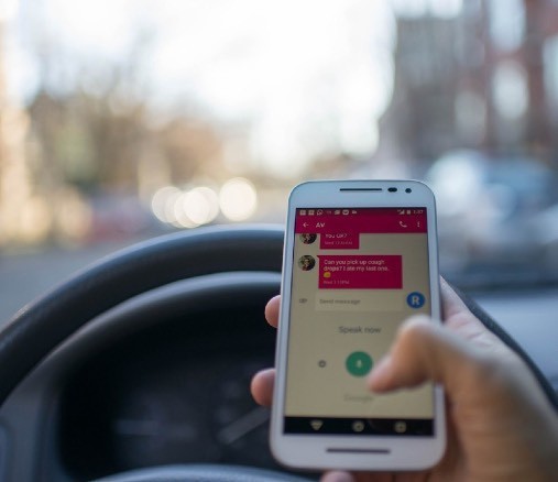 Person using cell phone while driving