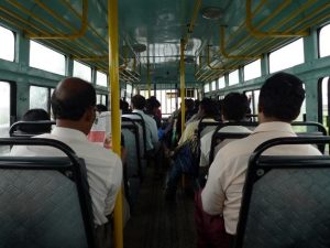 People sitting inside of a bus