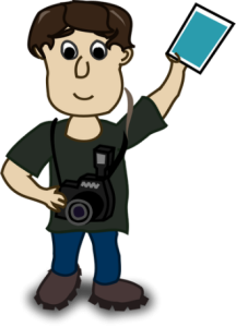 A photographer holding a photograph