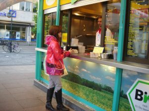 "Ordering some organic currywurst" by 10 Corso Como is licensed under CC BY 2.0.